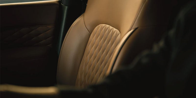 Close-up of luxurious leather seat inside the Infiniti SUV.